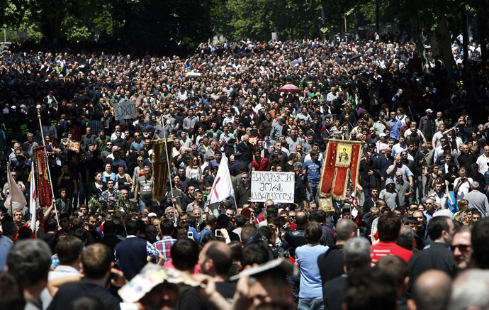 Orthodox Christian activists march before clashes with gay rights activists at an International Day Against Homophobia and Transphobia (IDAHO) rally in Tbilisi